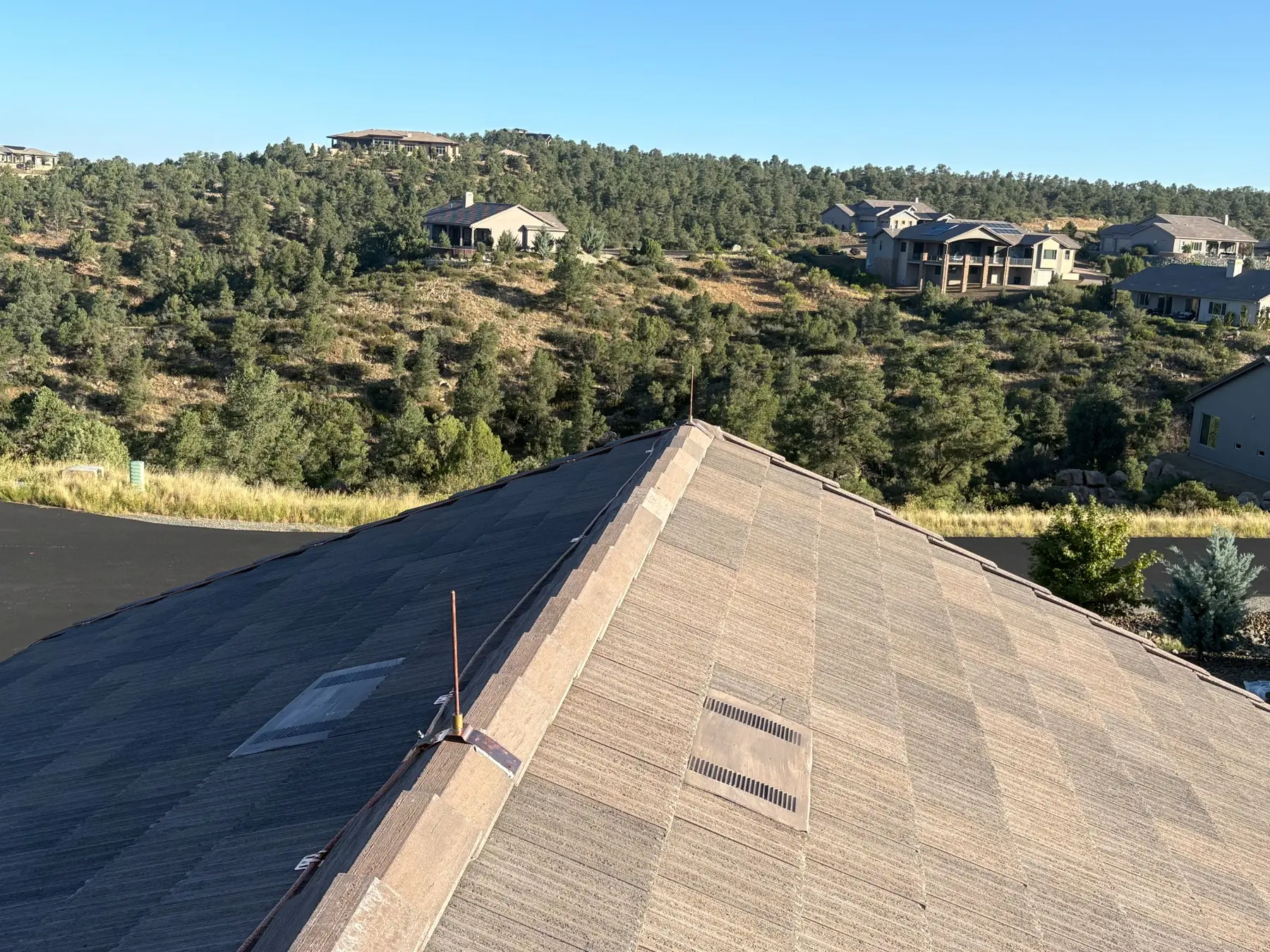 Copper air terminal and conductor routed along tile roof ridge in Prescott Arizona