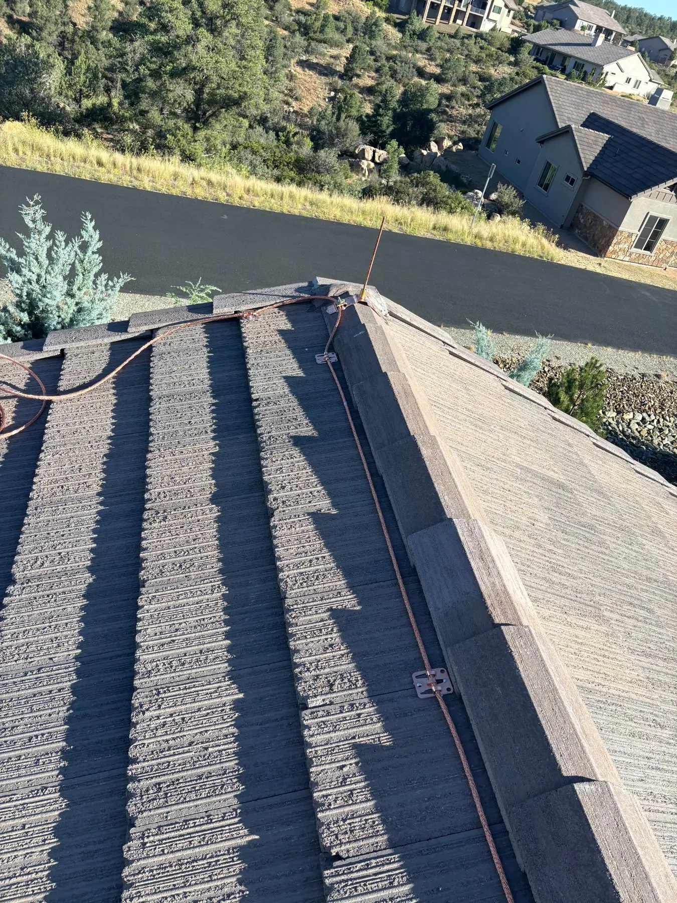 Copper lightning protection cable and air terminal on Prescott home ridge