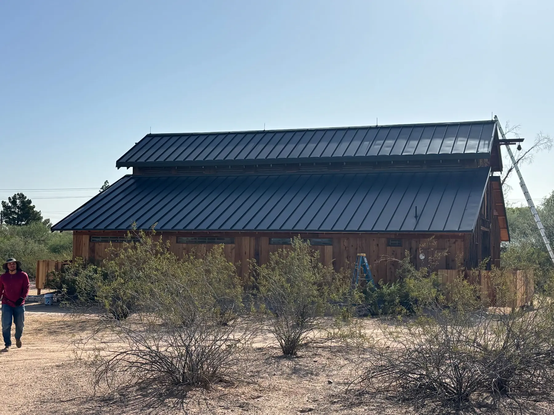 Completed lightning protection system on a Scottsdale Arizona horse barn with a standing-seam metal roof
